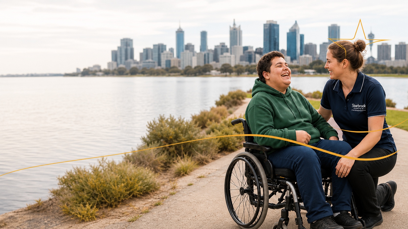 A Starbrook support worker sharing a joyful moment with a wheelchair user beside the Perth waterfront